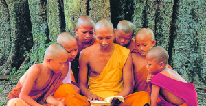 Buddhist monk surrounded by students