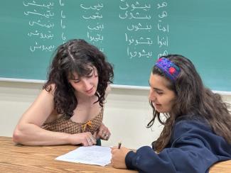 Two students studying Arabic